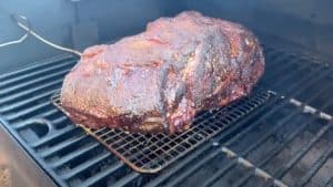 a pork butt smoking on a pit boss pellet grill