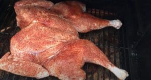 placing a spatchcock turkey on the pellet grill