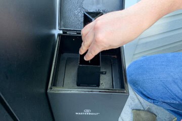 adding wood chips to the Masterbuilt cold smoker attachment