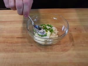 mixing up horseradish cream for a smoked beef tenderloin