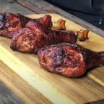 smoked turkey legs on a cutting board
