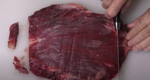 trimming fat off a flank steak