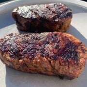 Two smoked filet mignon steaks on a plate