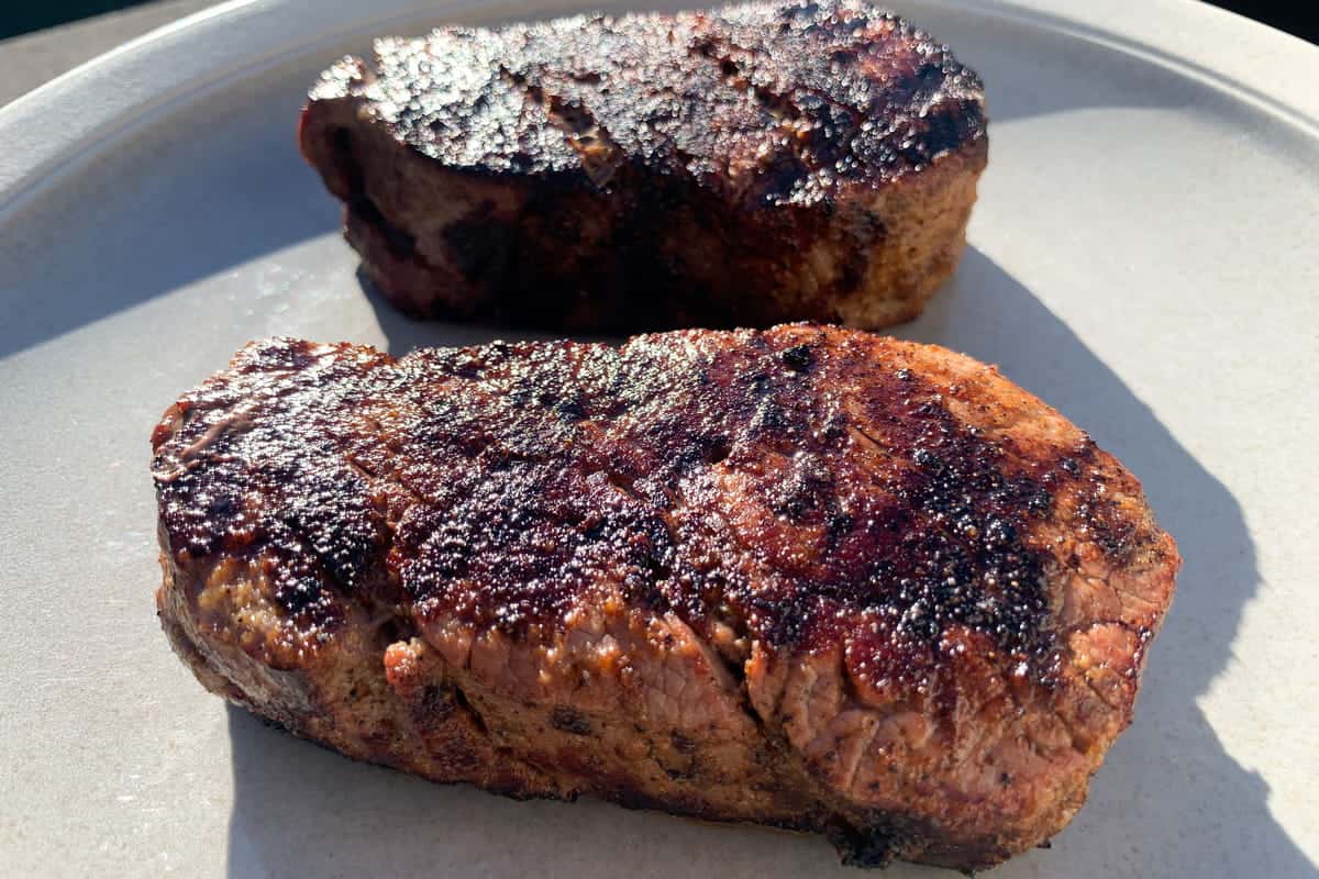 Two smoked filet mignon steaks on a plate