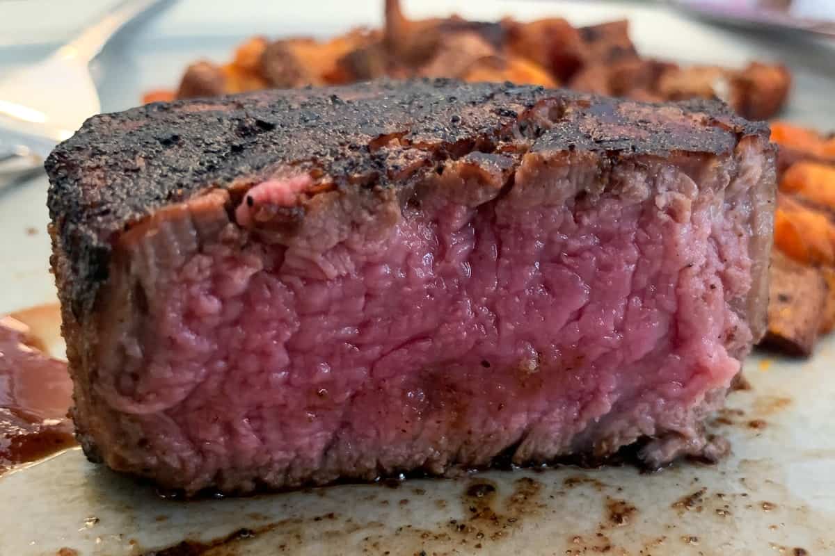 filet mignon cut in half to reveal the inside