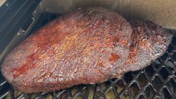 a beef brisket smoking on a pit boss pellet grill