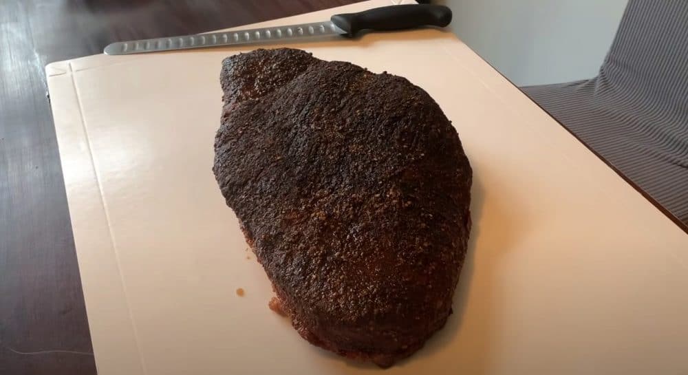 resting a traeger smoked beef brisket on a cutting board