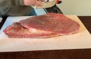 seasoning a raw beef brisket
