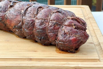 beef tenderloin resting on a cutting board