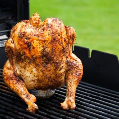 a beer can chicken smoking on a traeger or pit boss pellet grill
