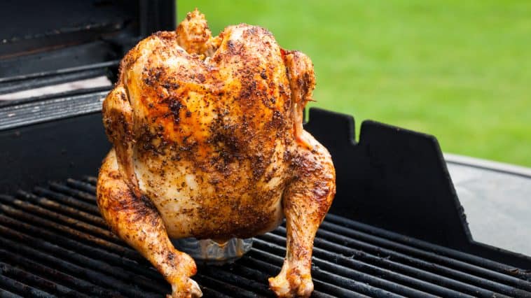 a beer can chicken smoking on a traeger or pit boss pellet grill