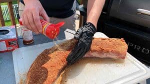 seasoning a pork loin with bbq rub