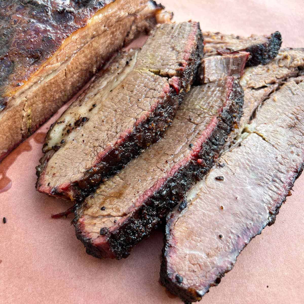 smoked brisket sliced on butcher paper