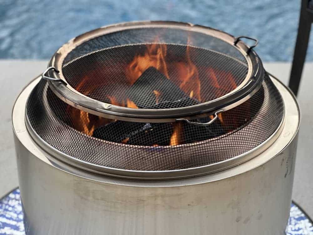 solo stove with the solo stove shield and screen on top