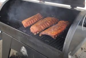 three slabs of baby back ribs on a pit boss pellet grill