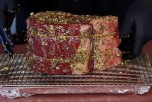 garlic marinade spread on a raw prime rib roast