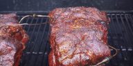 a pork butt smoking on a camp chef pellet grill
