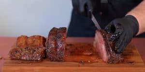 slicing a pit boss smoked prime rib