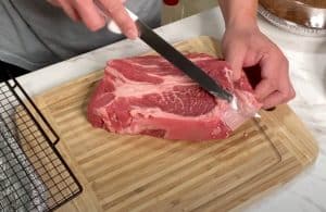 trimming fat from chuck roast