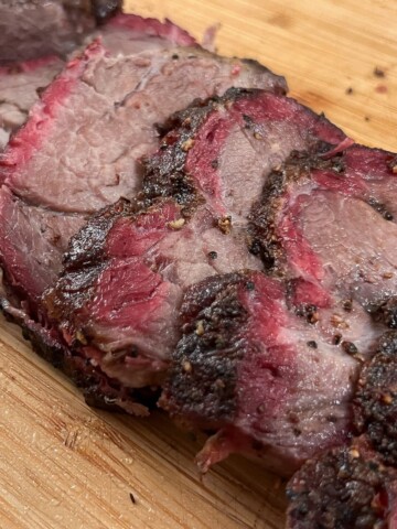 slices of smoked chuck roast on a cutting board