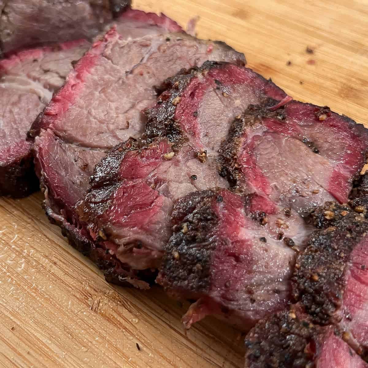 slices of smoked chuck roast on a cutting board