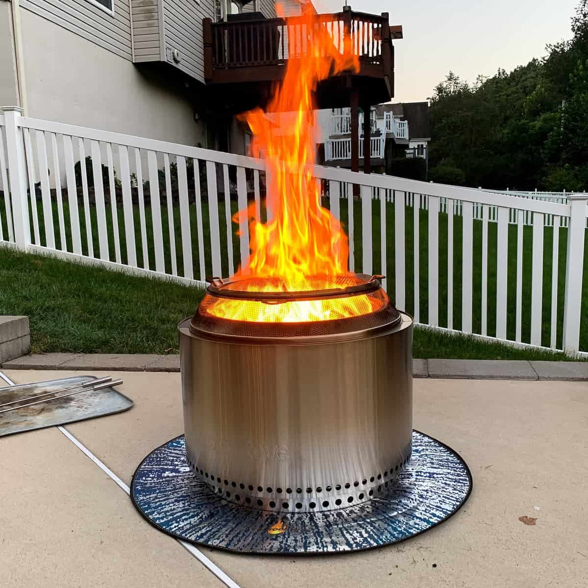 a solo stove with a large flame shooting up