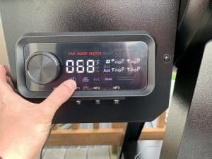 powering on a pit boss pellet grill