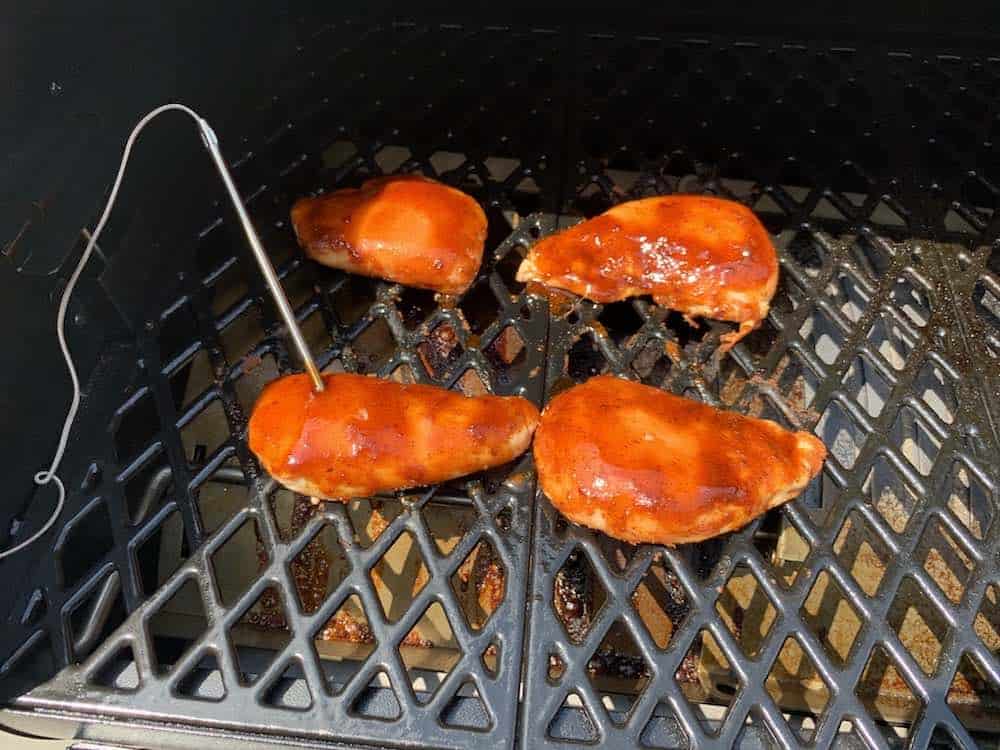 a temperature probe in a smoked chicken breast on a pit boss pellet grill