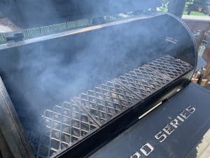 a pit boss pellet grill smoking with white smoke