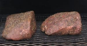 putting two bottom round beef roasts on smoker