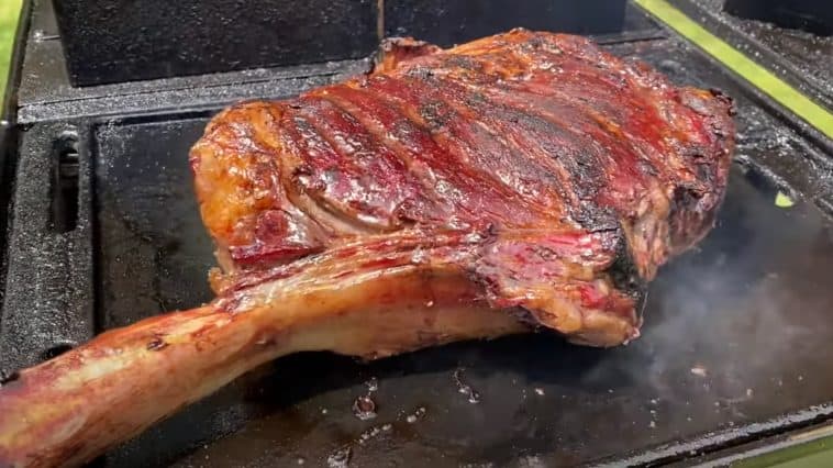 reverse searing a smoked tomahawk steak on a grill