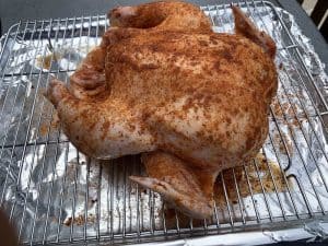 a brined and seasoned whole chicken