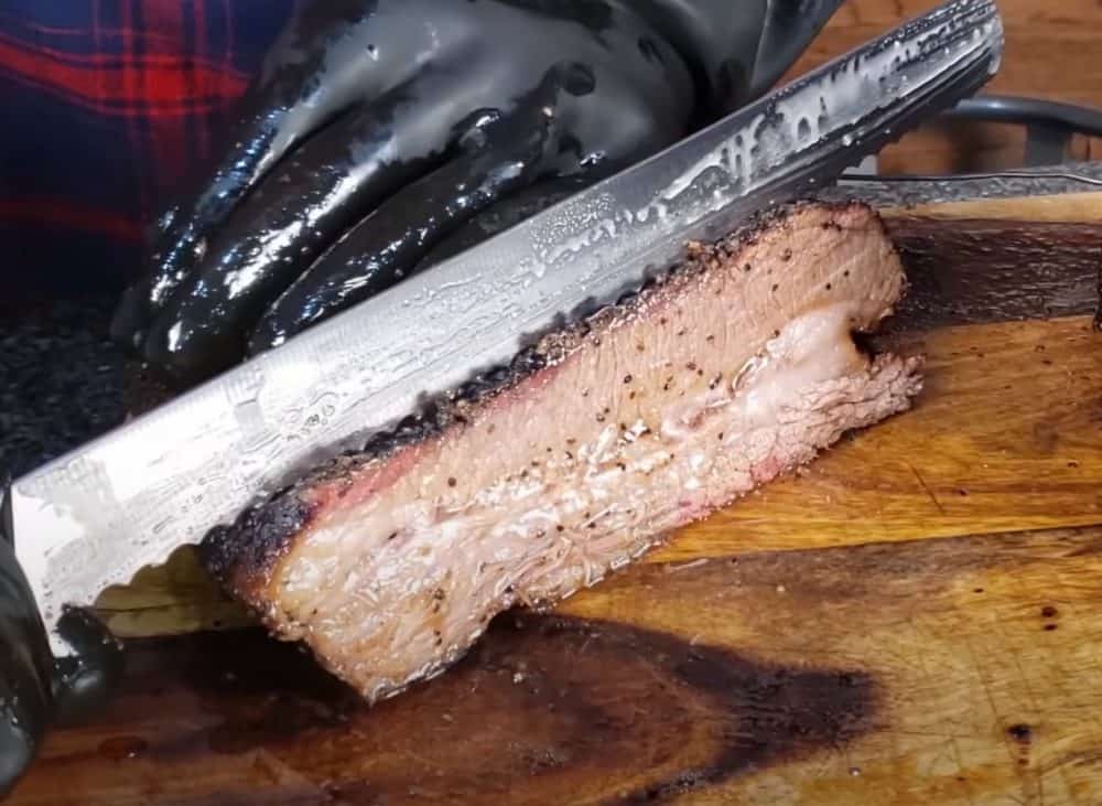 slicing a smoked beef brisket