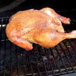 a whole chicken smoked on a traeger pellet grill