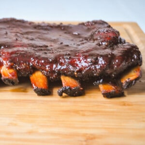 smoked spareribs on a wooden cutting board