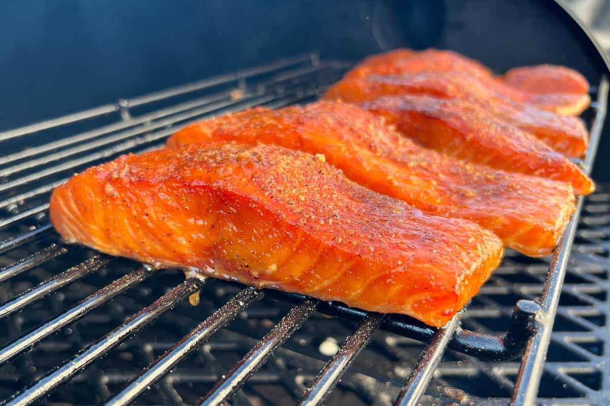 salmon smoking on the top rack of a pit boss pellet grill