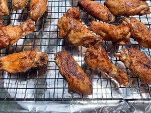Chicken wings crisping up on wire rack