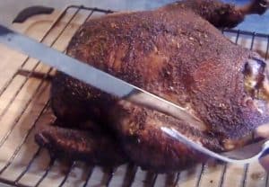carving a whole smoked chicken