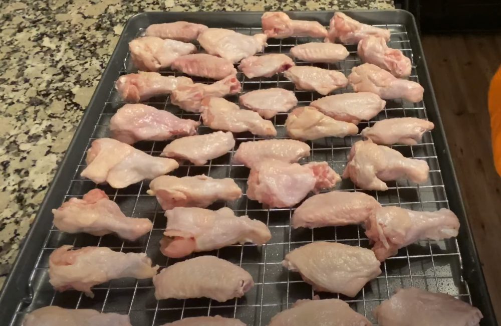 chicken wings on a rack to dry brine