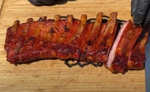 slicing smoked pork spare ribs