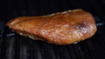 a smoked tuna steak on a grill