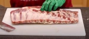 removing membrane from trimmed pork spare ribs