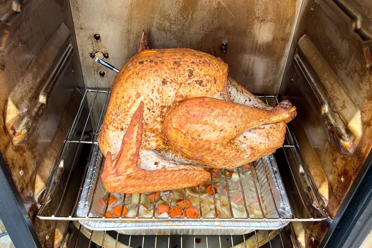 a whole turkey inside a masterbuilt electric smoker