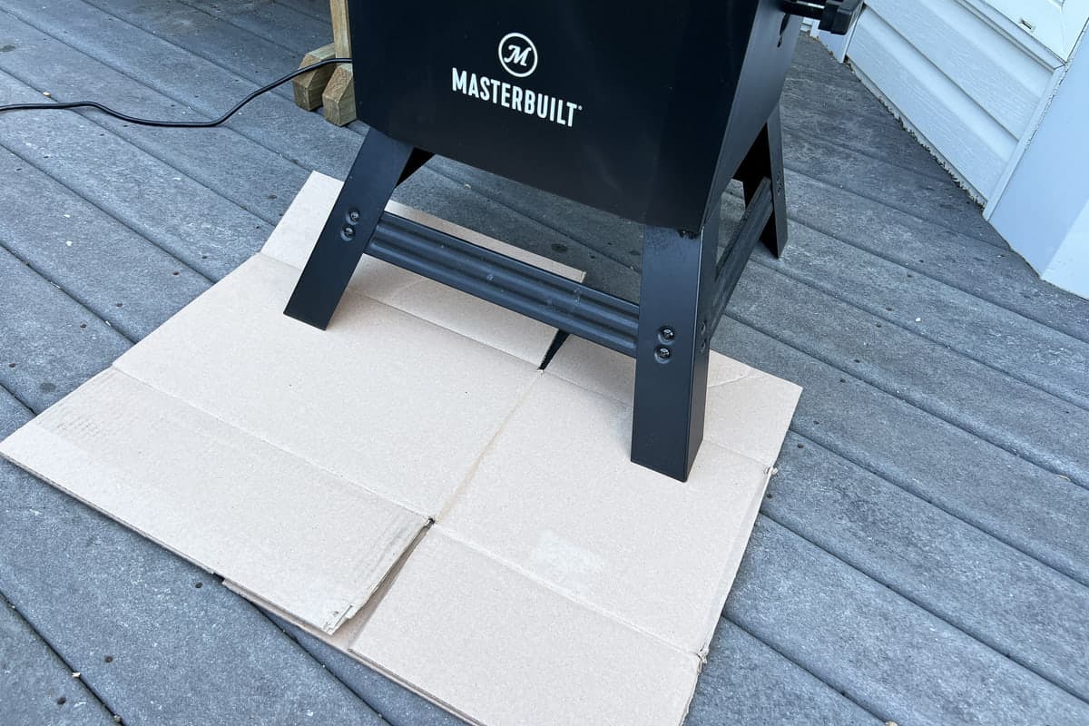 cardboard under the front two legs of the masterbuilt electric smoker