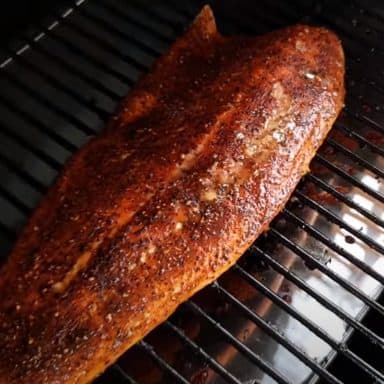 salmon smoking on a traeger pellet grill