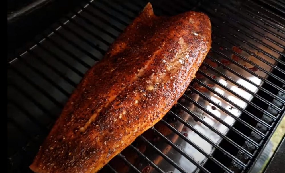 salmon smoking on a traeger pellet grill