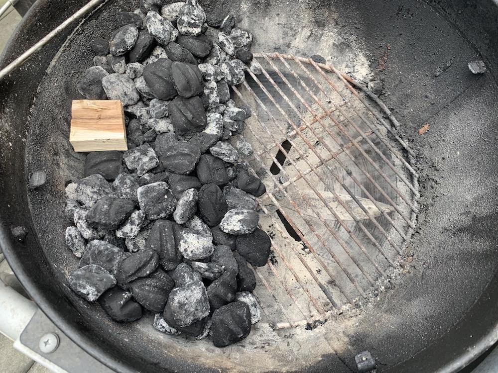 a charcoal grill set up for indirect smoking