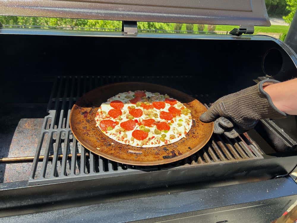 rotating a frozen pizza on a pellet grill