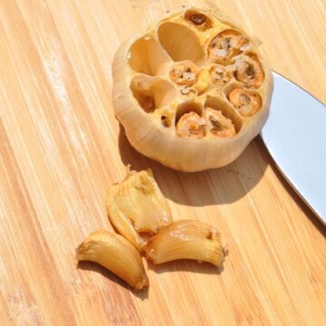 smoked garlic on a cutting board