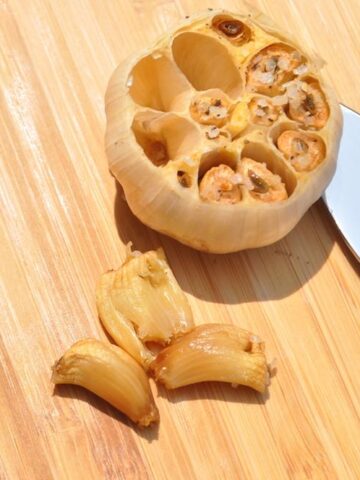 smoked garlic on a cutting board